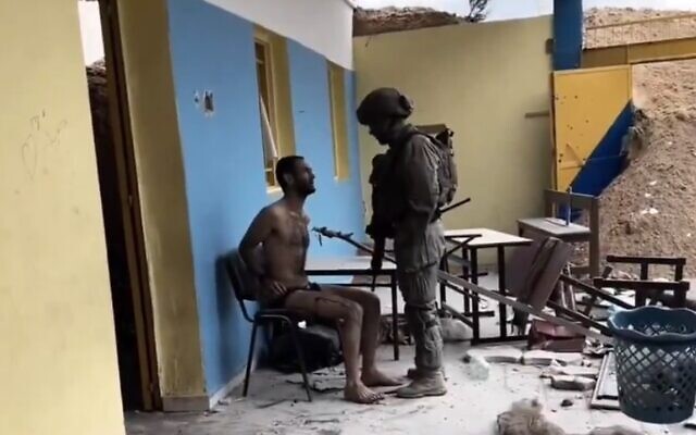 IDF soldier and prisoner screen capture