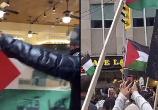 Protesters wave Palestinian flags outside of Cafe Landwer at University Avenue and Adelaide Street in Toronto Saturday, Oct. 21, 2023. 
