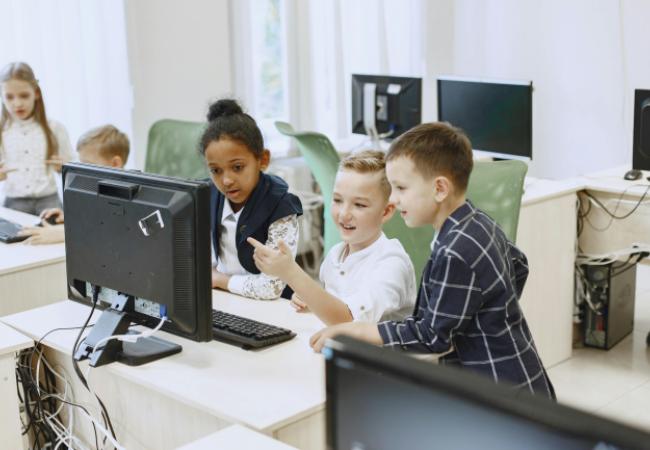Young children looking at a computer screen