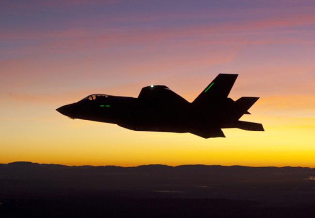 F-35 first night flight -- plane against sunset sky