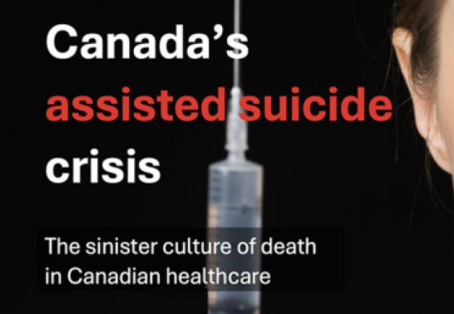 A woman staring straight ahead, holding a syringe