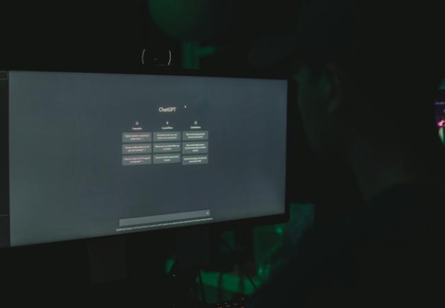Computer screen with a small table showing ChatGPT examples, capabilities and limitations