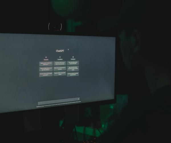 Computer screen with a small table showing ChatGPT examples, capabilities and limitations